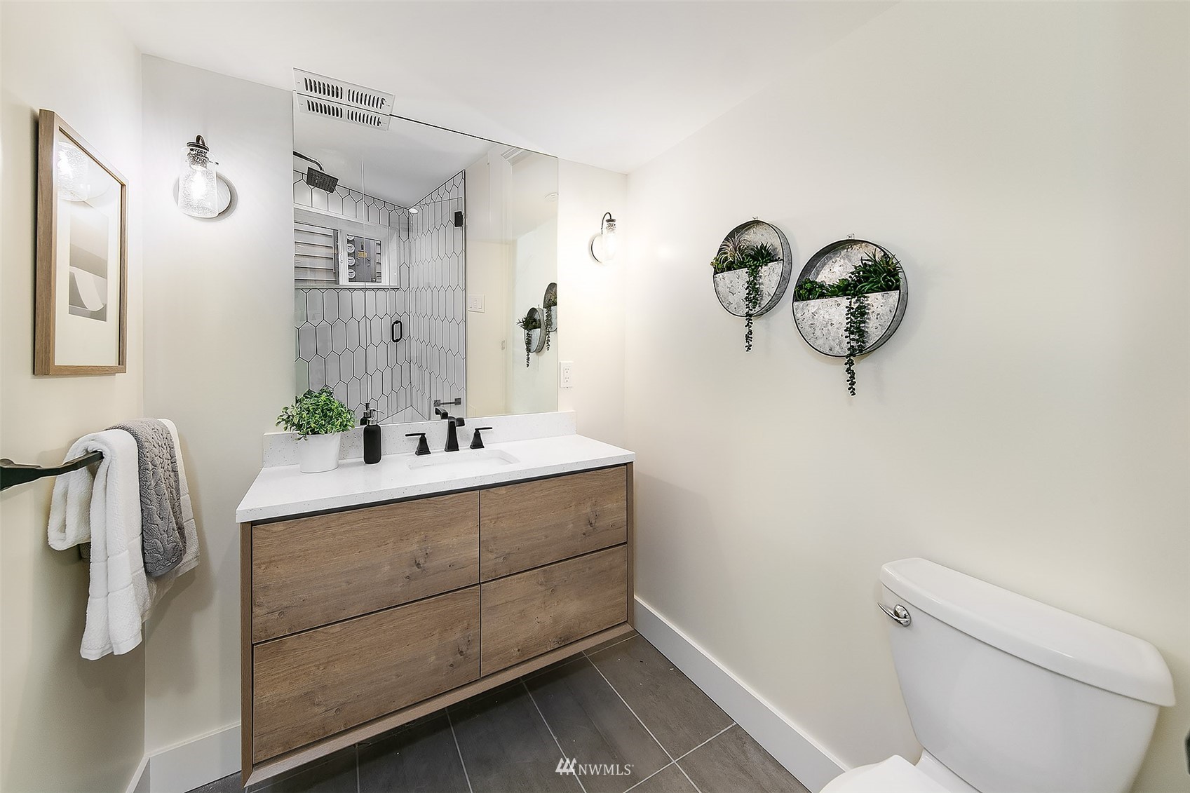 2143 6th Avenue West Seattle, WA 98119 - Photo 17 of 31 a bathroom with a sink and mirror