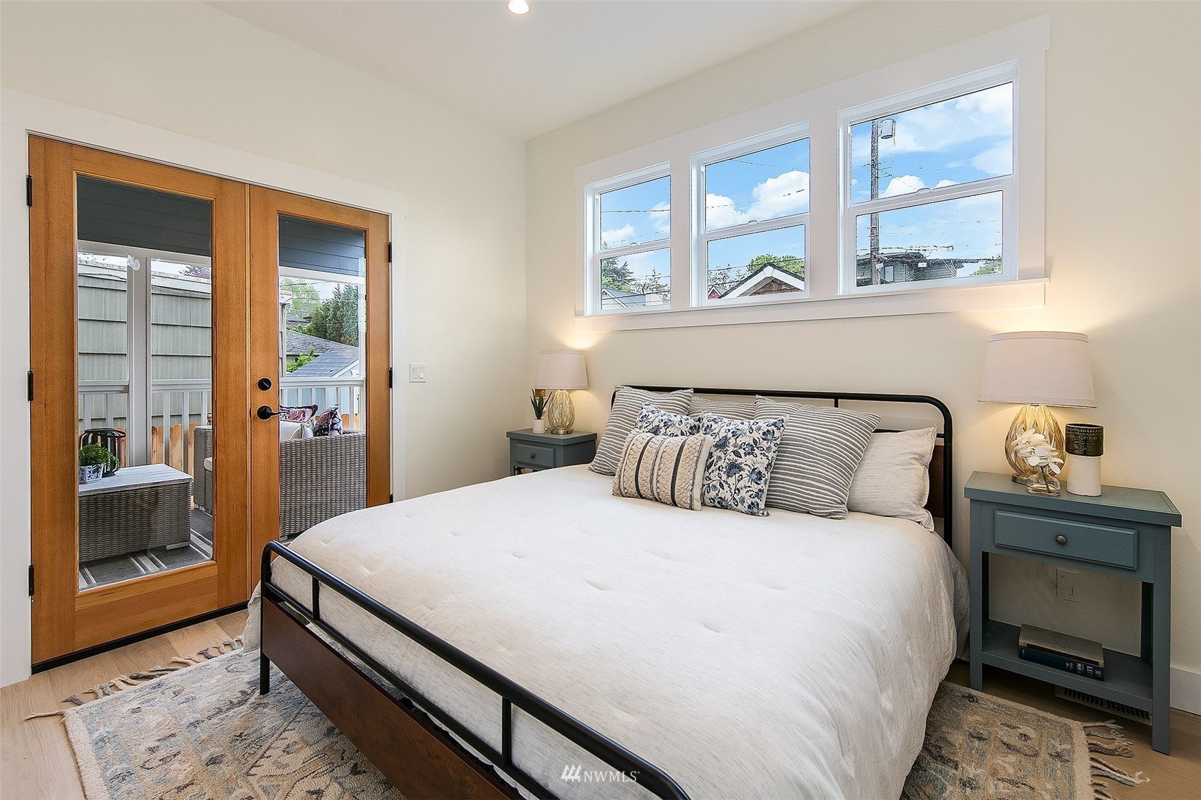 2143 6th Avenue West Seattle, WA 98119 - Photo 18 of 31 a bedroom with a large bed and a window