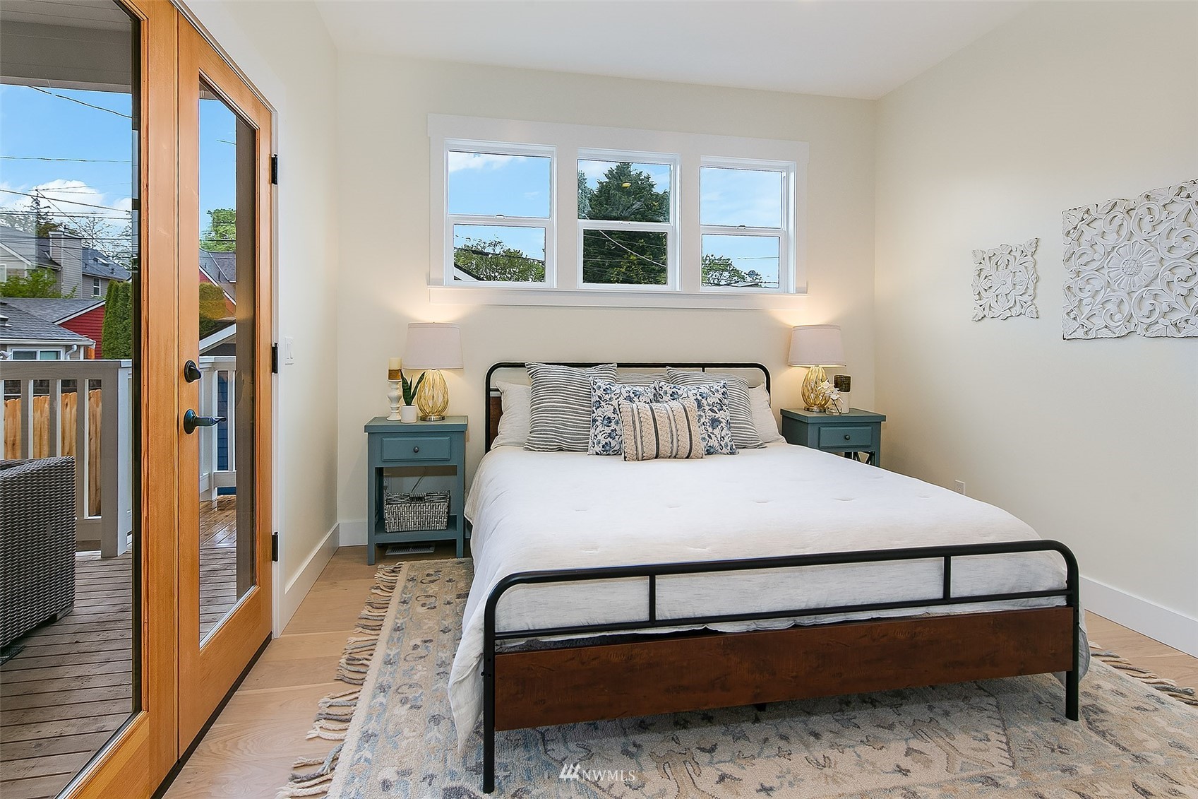 2143 6th Avenue West Seattle, WA 98119 - Photo 19 of 31 a bedroom with a bed and window