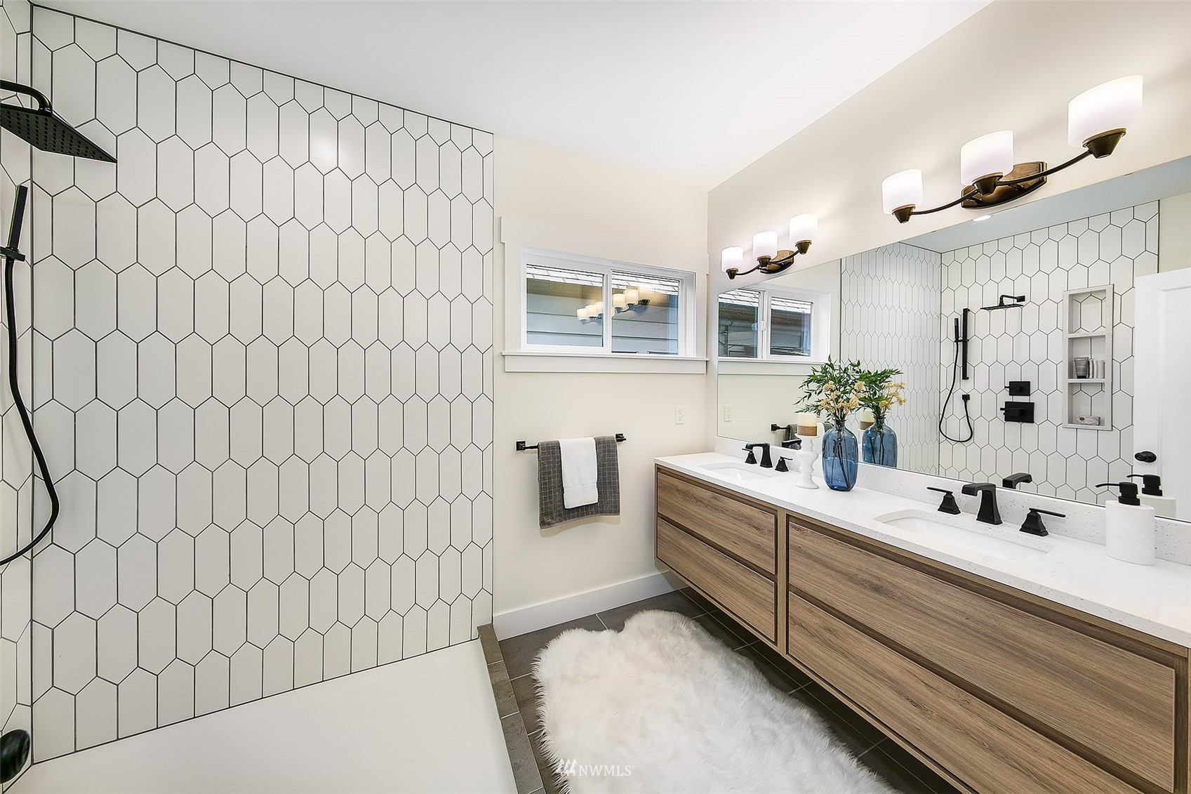 2143 6th Avenue West Seattle, WA 98119 - Photo 20 of 31 a bathroom with a sink and a mirror