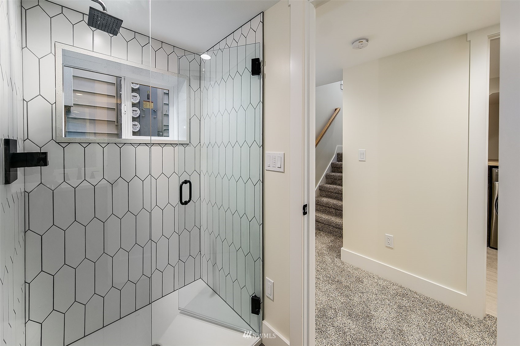 2143 6th Avenue West Seattle, WA 98119 - Photo 23 of 31 a view of a bathroom from the hallway