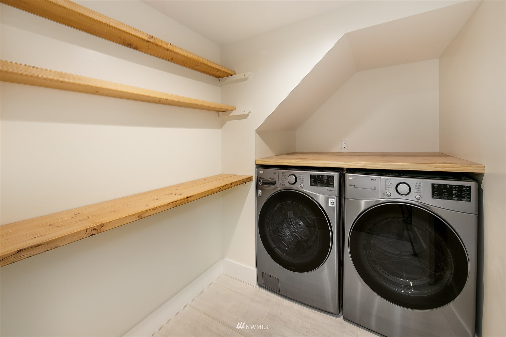 2143 6th Avenue West Seattle, WA 98119 - Photo 26 of 31 a utility room with dryer and washer
