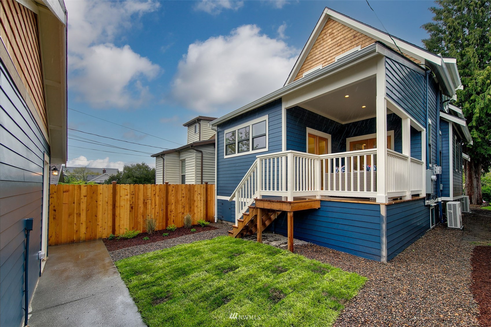 2143 6th Avenue West Seattle, WA 98119 - Photo 29 of 31 a view of house with a yard