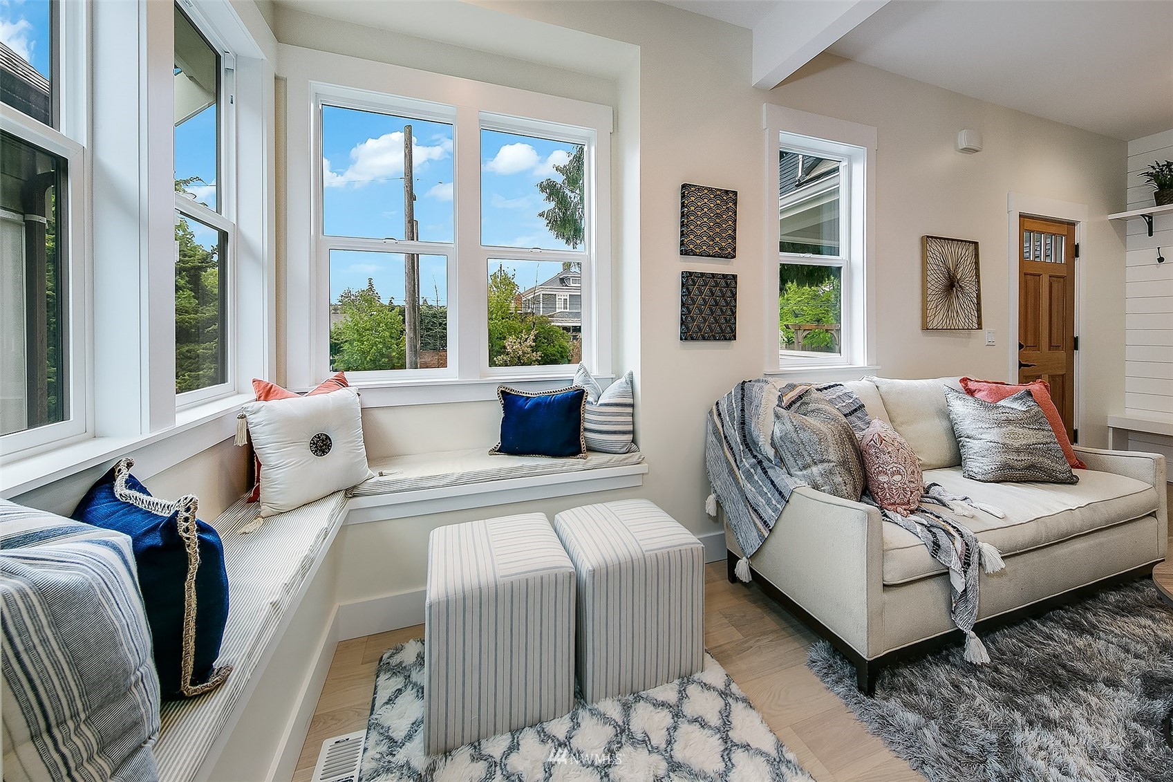 2143 6th Avenue West Seattle, WA 98119 - Photo 3 of 31 a bedroom with a bed and glass window
