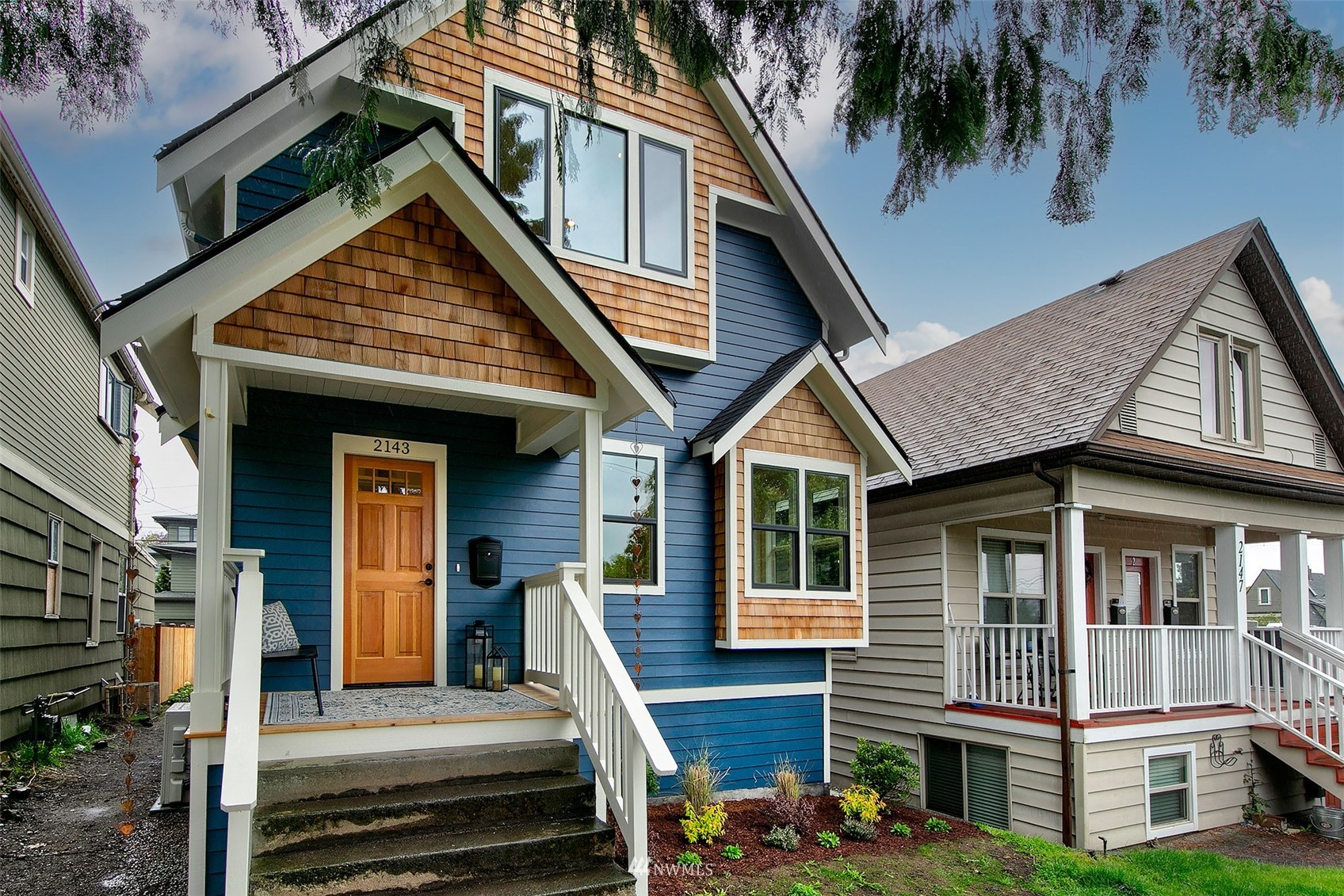 2143 6th Avenue West Seattle, WA 98119 - Photo 31 of 31 a front view of a house with a garden