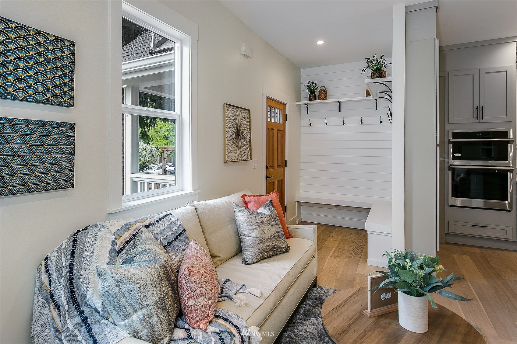 2143 6th Avenue West Seattle, WA 98119 - Photo 4 of 31 a living room with furniture and a potted plant