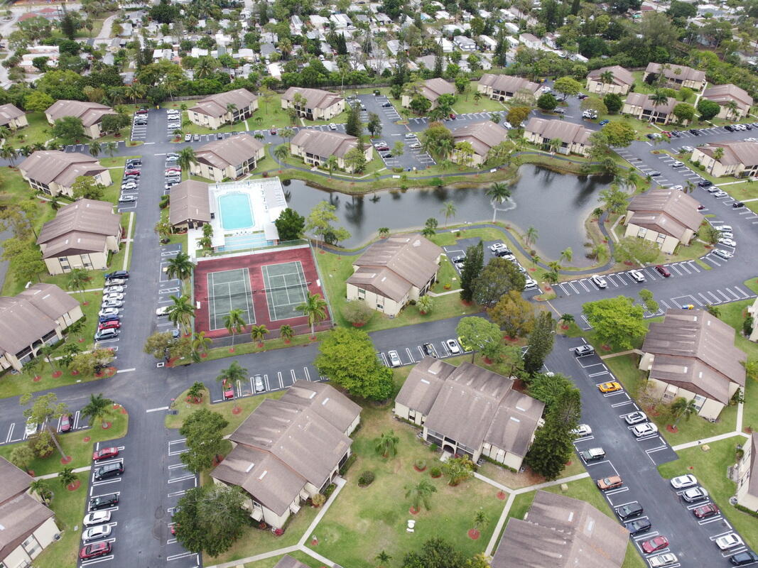 320 Pine Ridge Circle, Unit A1 Greenacres, FL 33463 - Photo 51 of 65 an aerial view of residential houses with outdoor space