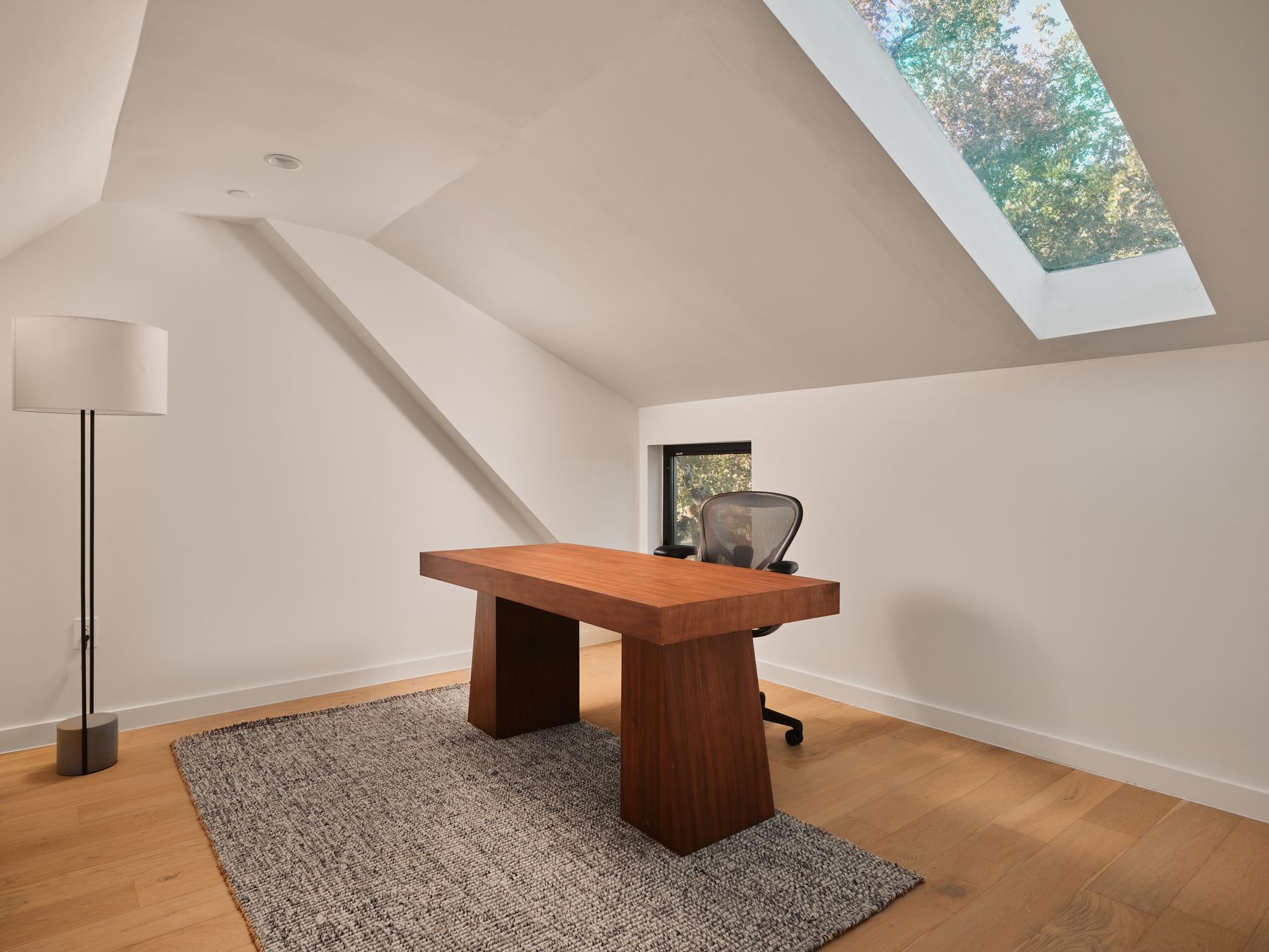 3209 Clawson Road Austin, TX 78704 - Photo 24 of 30 Unfurnished office with light wood-style floors, lofted ceiling, and a skylight