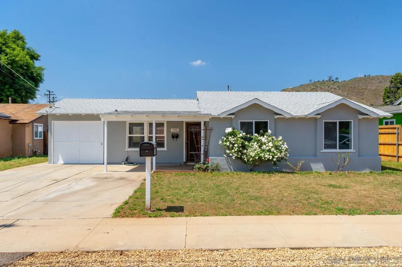 998 Joplin Drive El Cajon, CA 92021 - Photo 2 of 38 a front view of a house with garden