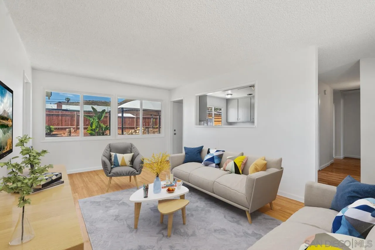 998 Joplin Drive El Cajon, CA 92021 - Photo 5 of 38 a living room with furniture and a potted plant on table