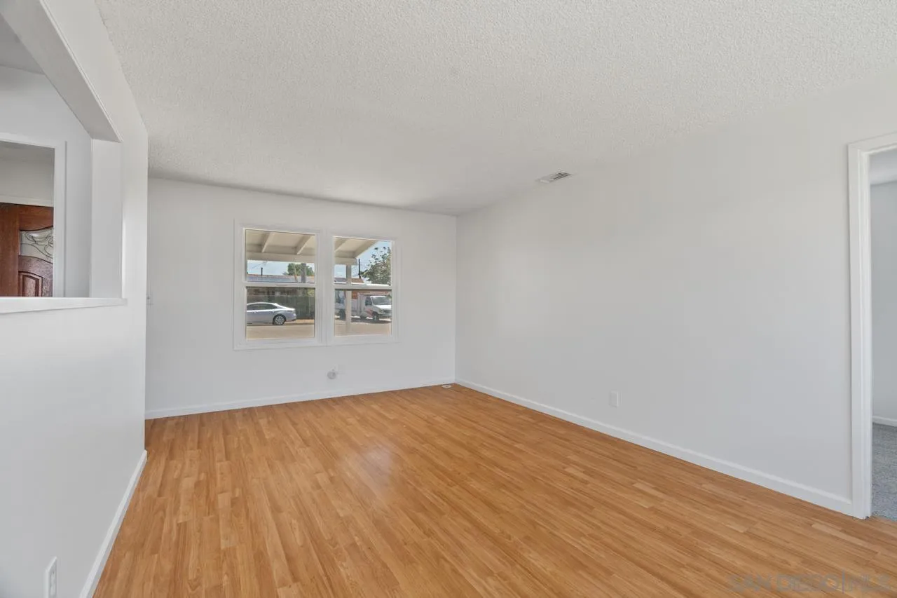998 Joplin Drive El Cajon, CA 92021 - Photo 8 of 38 a view of empty room with wooden floor