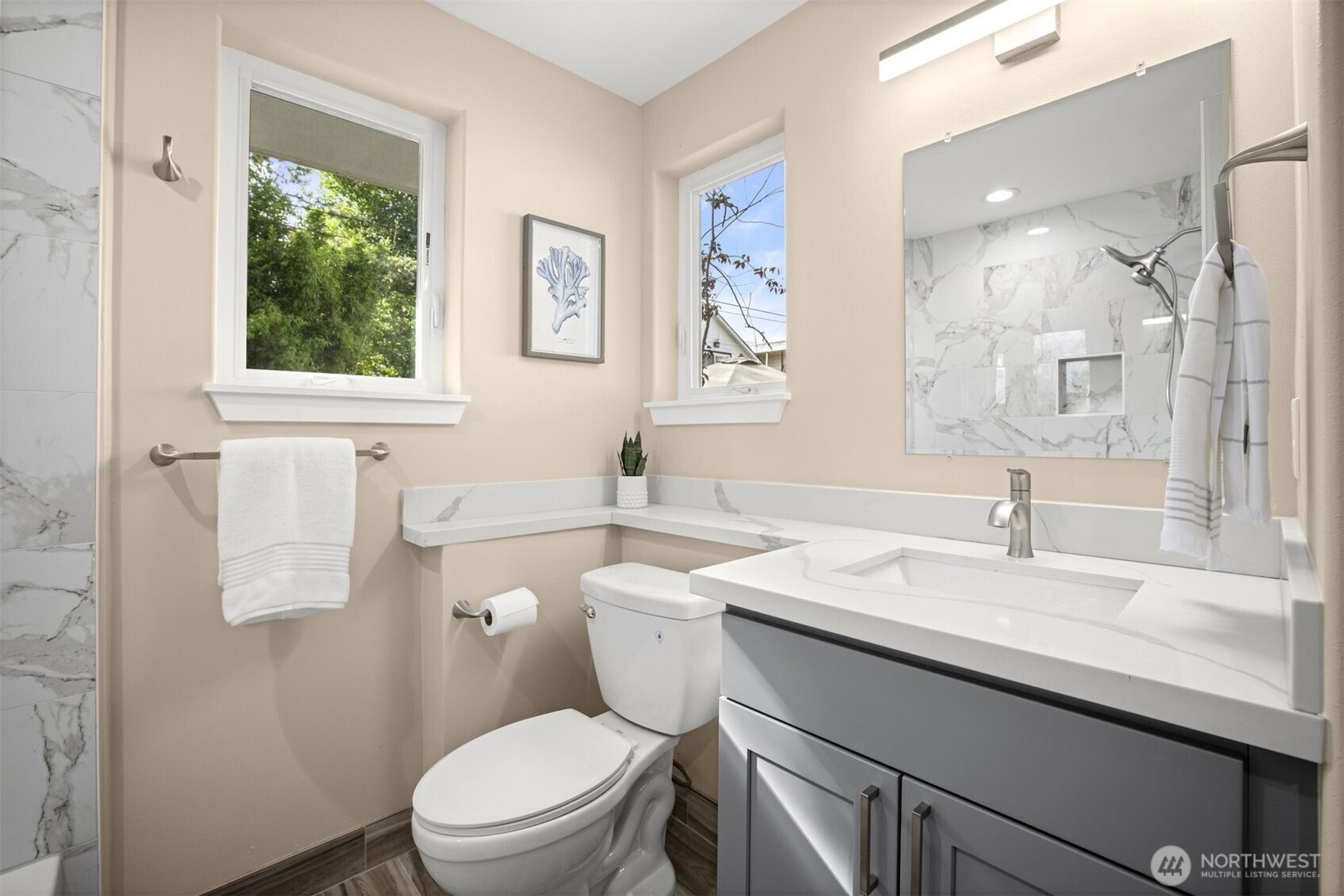 6419 Ellis Avenue South Seattle, WA 98108 - Photo 17 of 28 a bathroom with a sink a toilet and a window