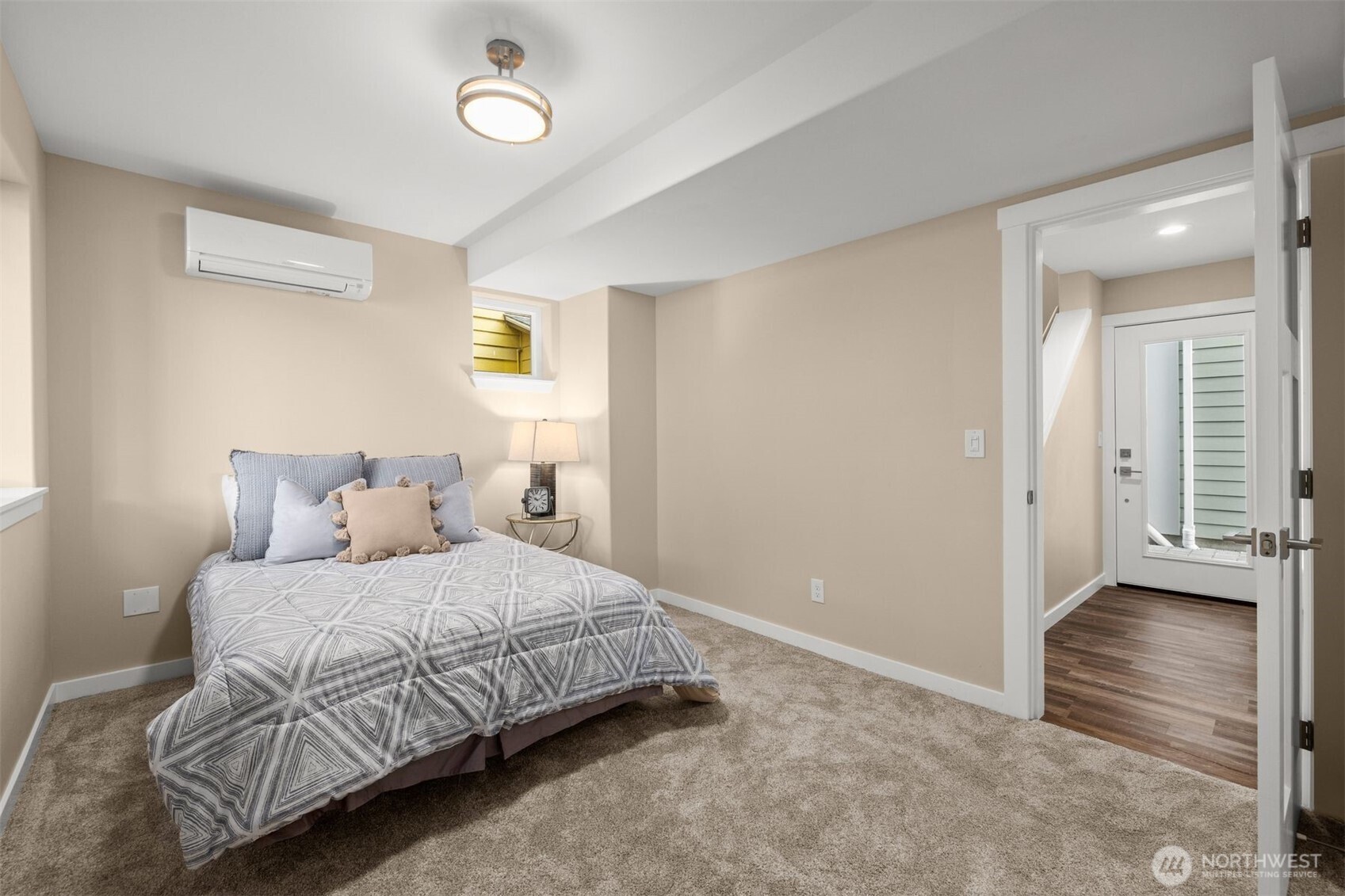 6419 Ellis Avenue South Seattle, WA 98108 - Photo 19 of 28 a bedroom with a bed and a walk in closet