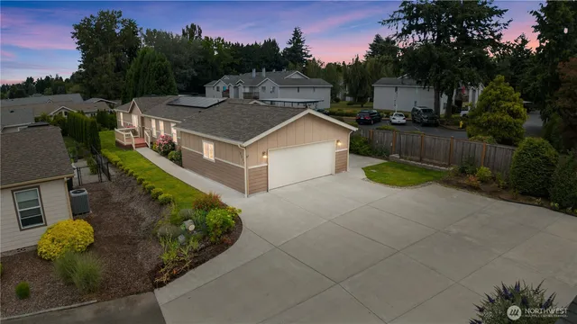 a aerial view of a house with pool table and chairs