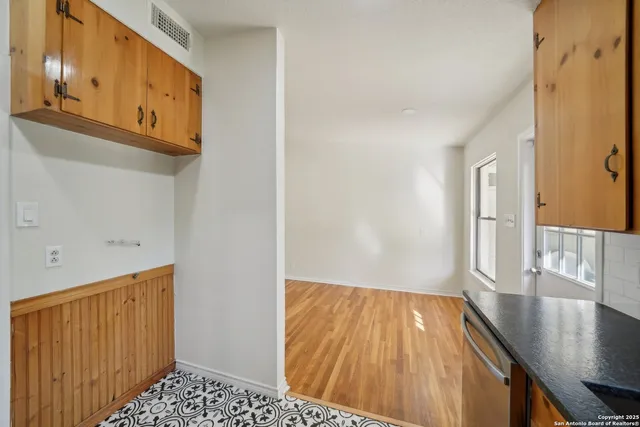 a view of a hallway view with wooden floor and staircase
