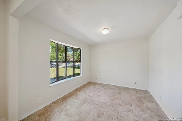 an empty room with windows