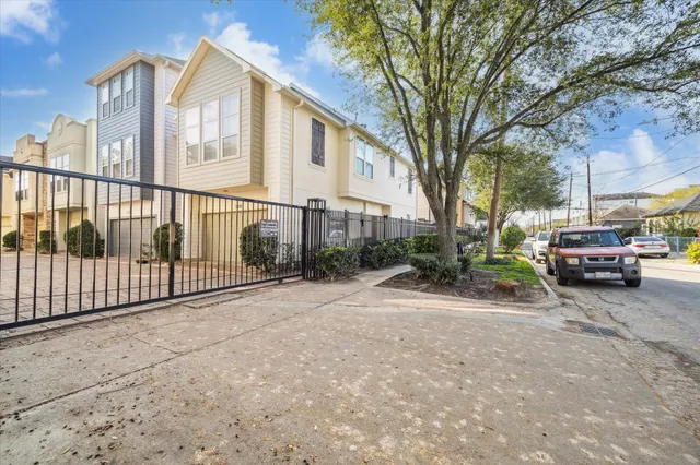a view of a door and brick walls