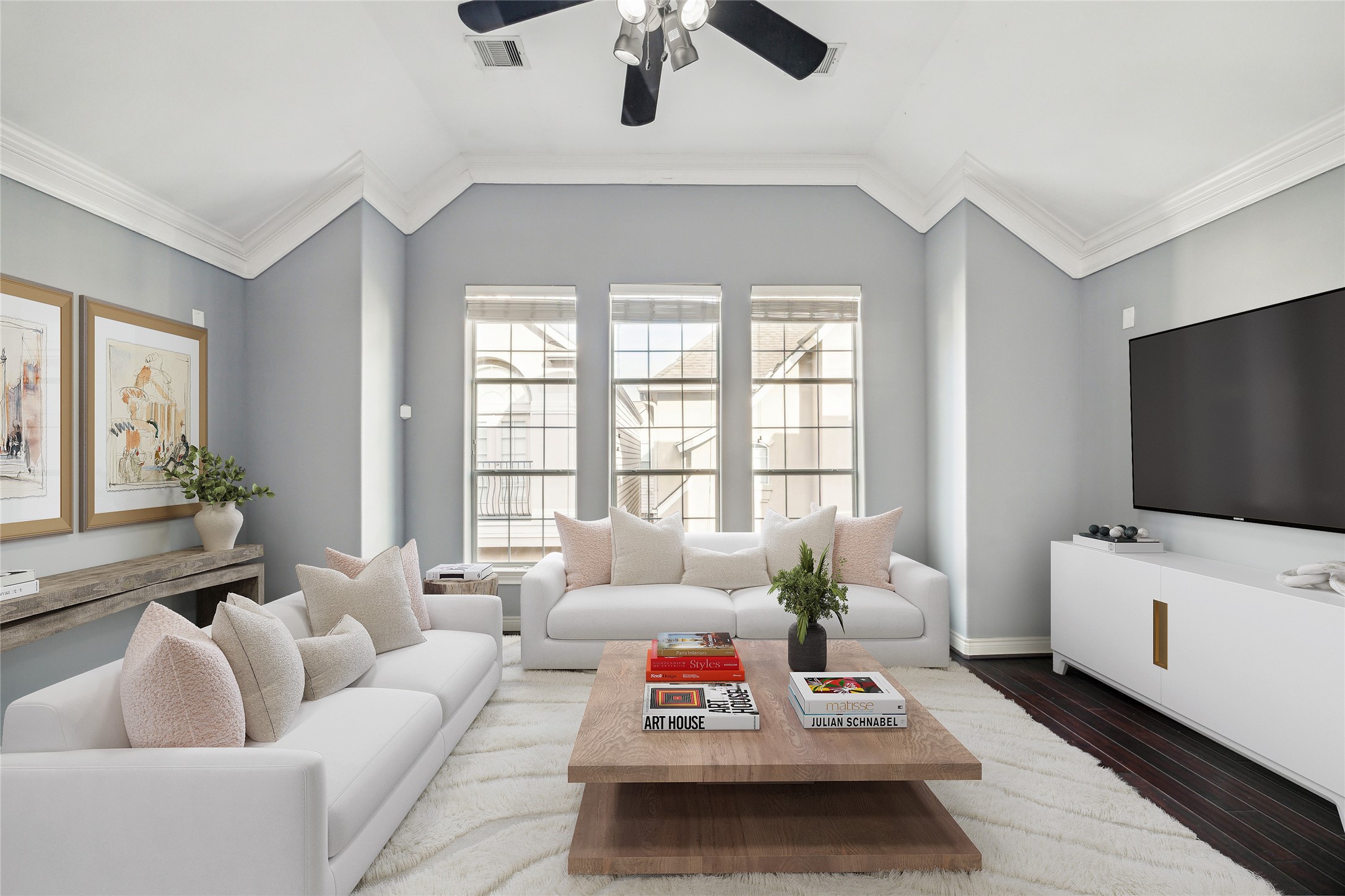 a living room with furniture and a flat screen tv