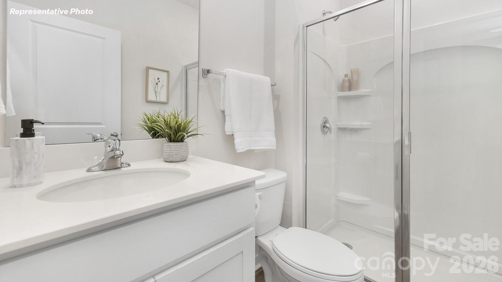 4560 Harris Elliot Road Lincolnton, NC 28092 - Photo 12 of 34 a bathroom with a sink toilet and shower