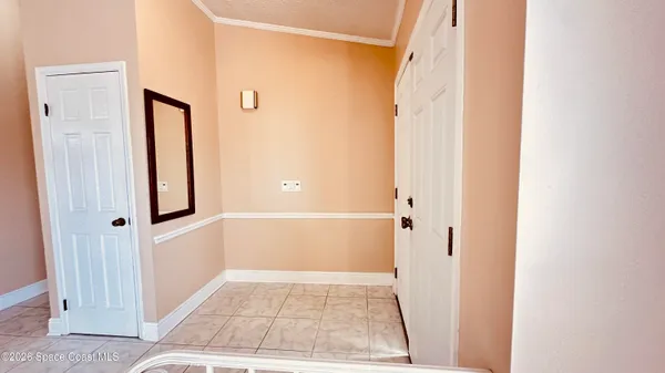 a large kitchen with stainless steel appliances kitchen island granite countertop a refrigerator and cabinets