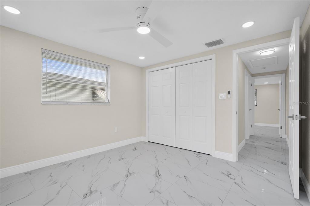 5626 Moog Road Holiday, FL 34690 - Photo 22 of 38 an empty room with a empty space and windows