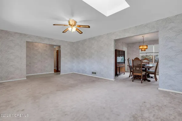 a view of livingroom with furniture and fan