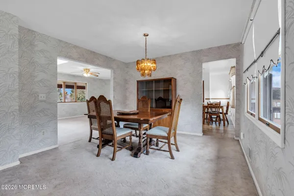 a dining room with furniture and window
