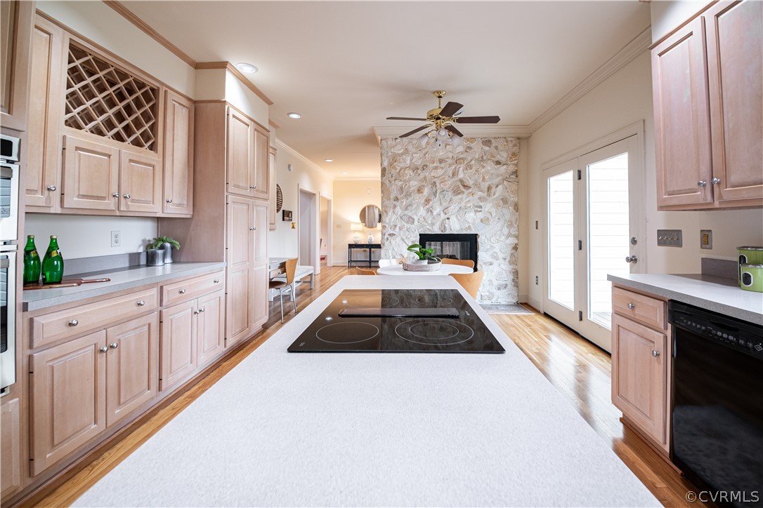 10497 Georgetown Road Mechanicsville, VA 23116 - Photo 19 of 50 a kitchen with granite countertop a stove top oven a sink a counter space and cabinets