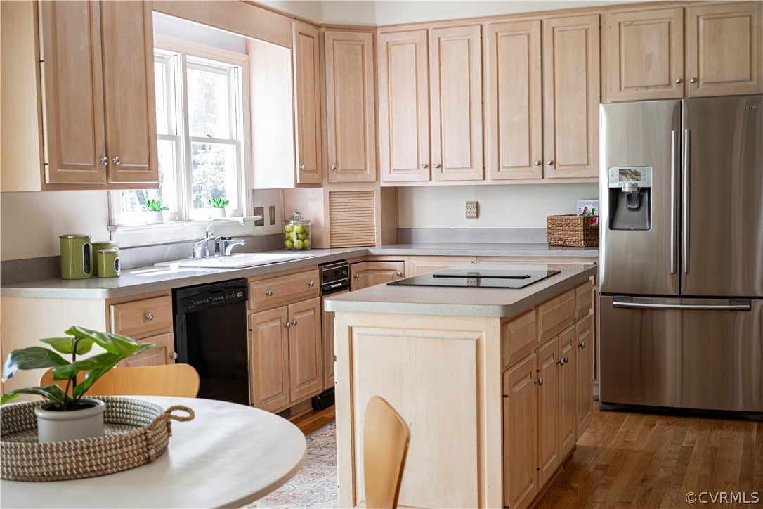 10497 Georgetown Road Mechanicsville, VA 23116 - Photo 20 of 50 a kitchen with stainless steel appliances a white refrigerator a sink a stove a dining table and chairs