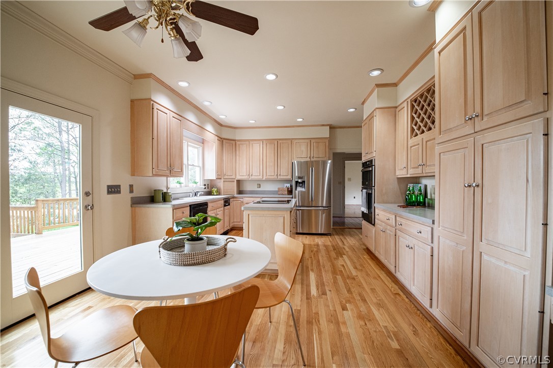 10497 Georgetown Road Mechanicsville, VA 23116 - Photo 25 of 50 a kitchen with stainless steel appliances kitchen island granite countertop a sink a stove a refrigerator cabinets and chairs
