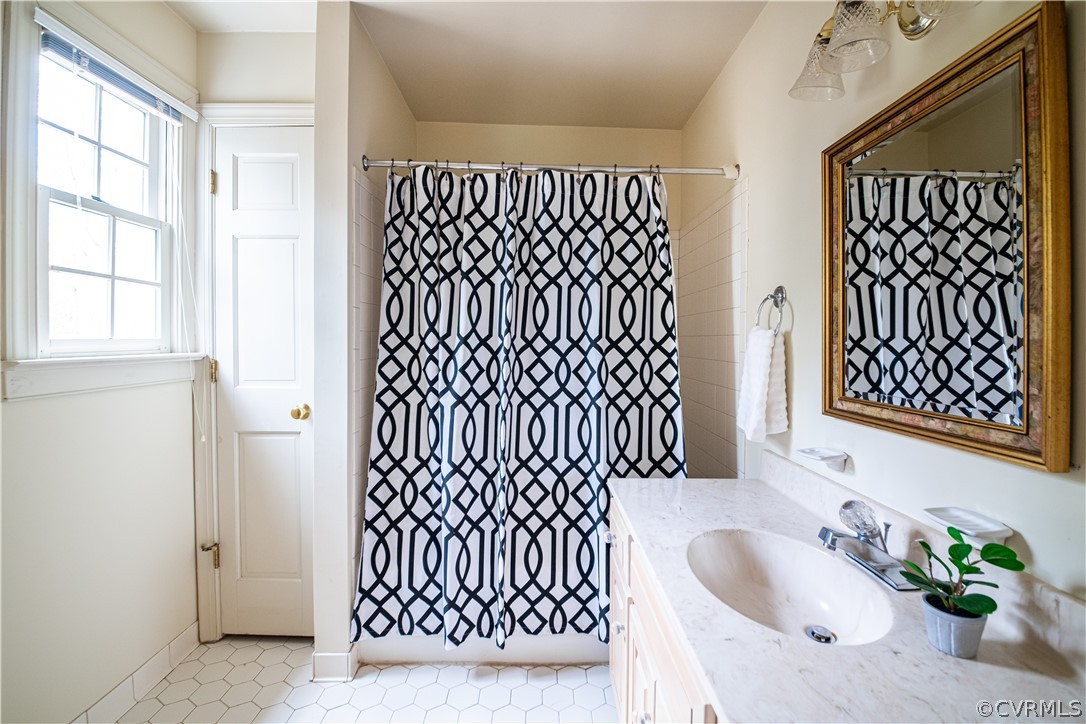 10497 Georgetown Road Mechanicsville, VA 23116 - Photo 27 of 50 a bathroom with a sink and a shower