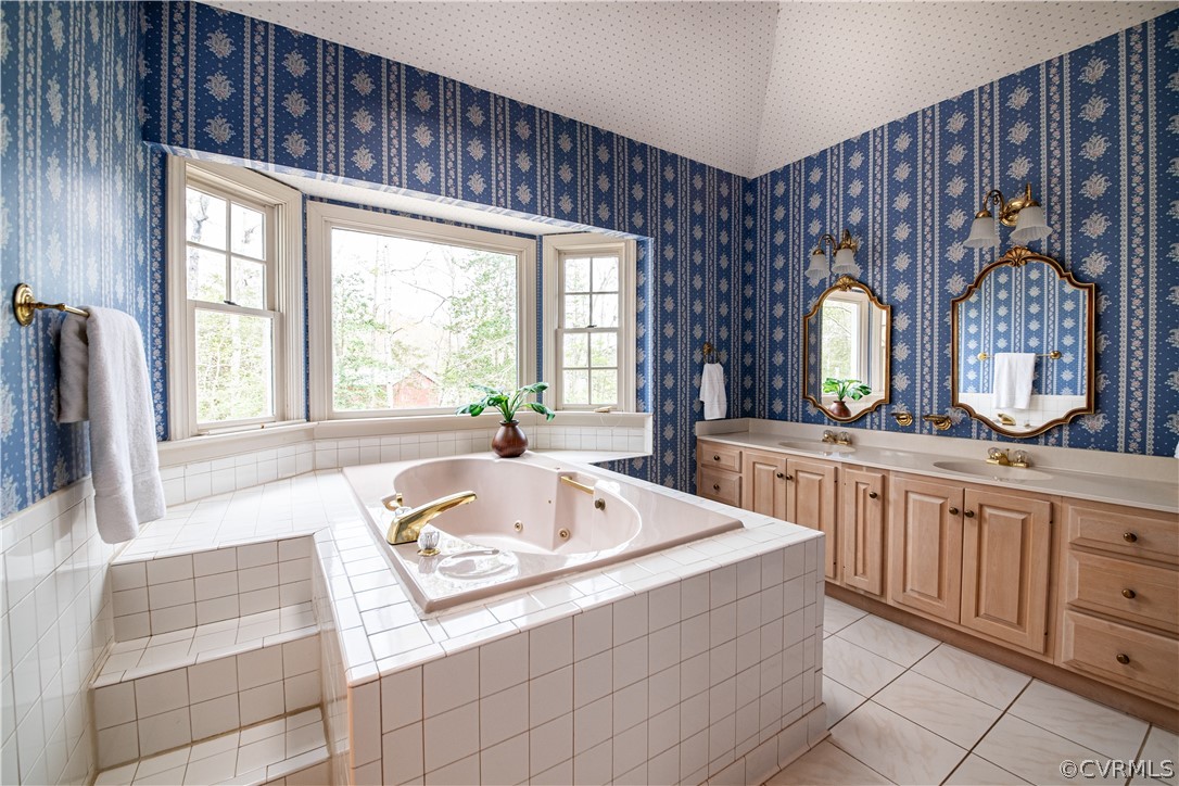 10497 Georgetown Road Mechanicsville, VA 23116 - Photo 31 of 50 a bathroom with a tub sink and mirror