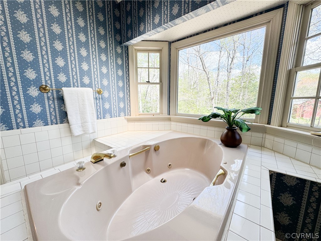 10497 Georgetown Road Mechanicsville, VA 23116 - Photo 32 of 50 a bathroom with a tub sink and window