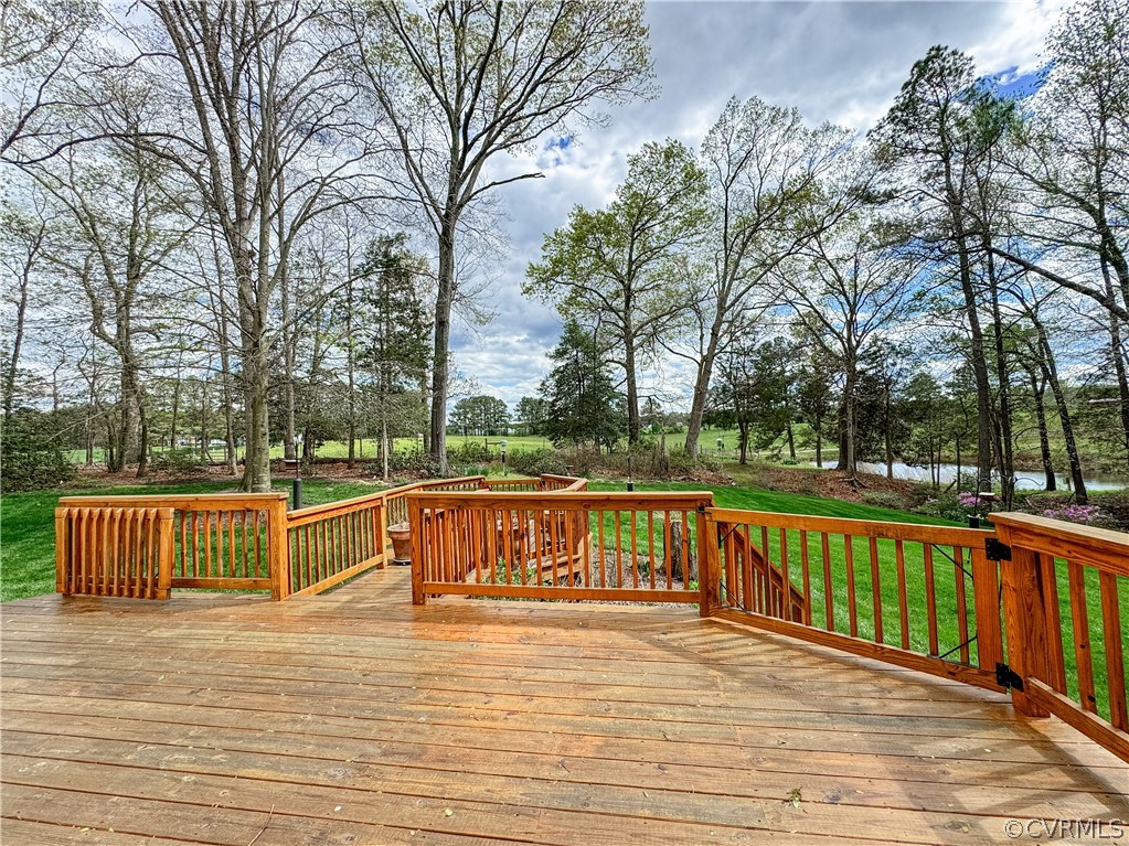 10497 Georgetown Road Mechanicsville, VA 23116 - Photo 42 of 50 a view of a wooden deck with a trees