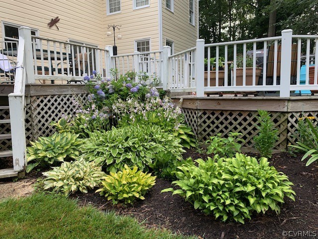 10497 Georgetown Road Mechanicsville, VA 23116 - Photo 44 of 50 a view of a house with a flower garden