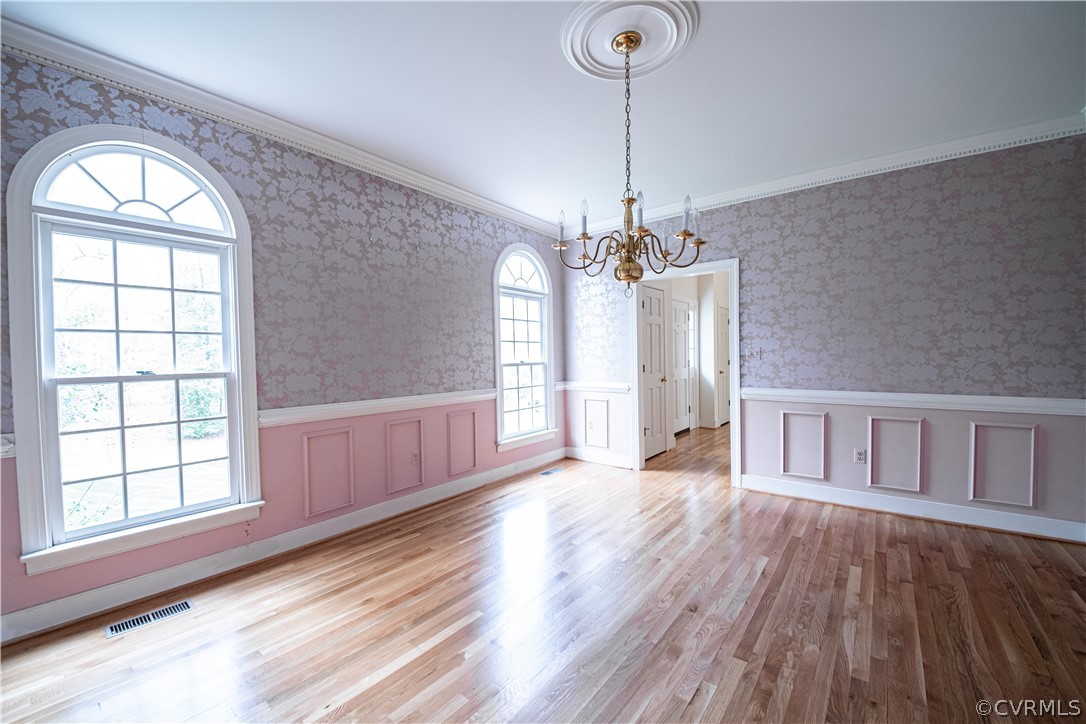 10497 Georgetown Road Mechanicsville, VA 23116 - Photo 6 of 50 a view of empty room with wooden floor and fan
