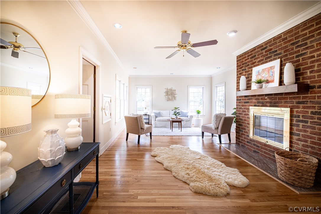 10497 Georgetown Road Mechanicsville, VA 23116 - Photo 9 of 50 a living room with furniture wooden floor and a fireplace