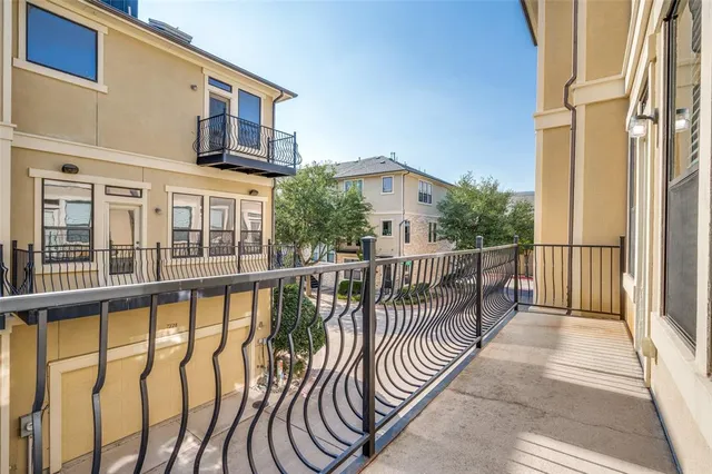a view of a balcony with chairs