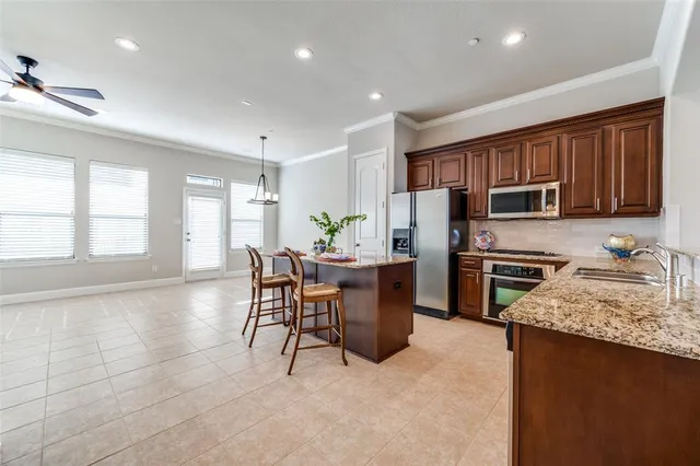 a kitchen with a refrigerator and a microwave