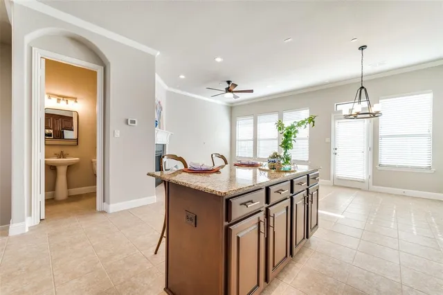 a kitchen with stainless steel appliances granite countertop a stove and a center island