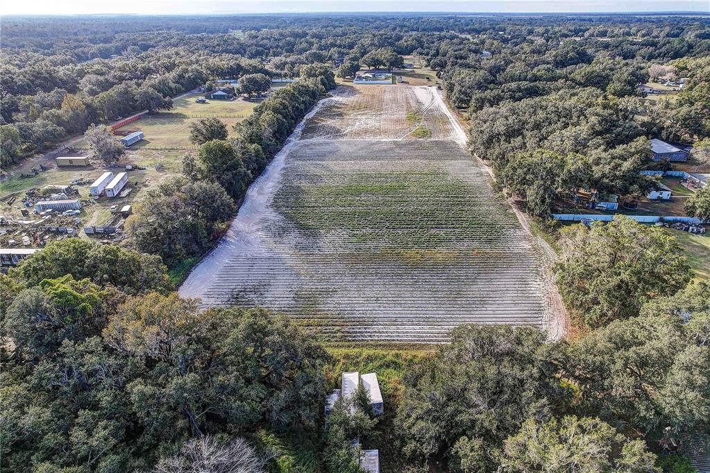 4822 Nesmith Road Plant City, FL 33567 - Photo 10 of 18 an aerial view of a house with a yard and lake view