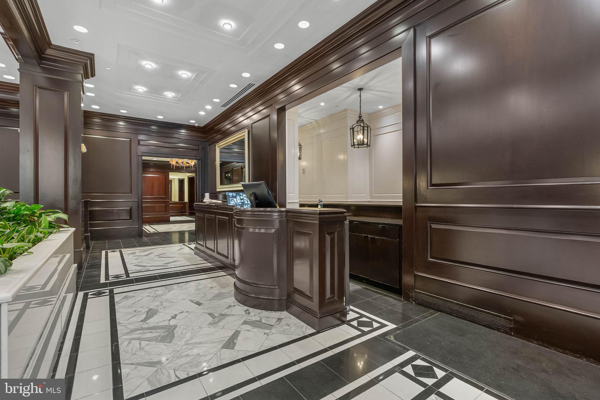 219 South 18th Street, Unit 404 Philadelphia, PA 19103 - Photo 15 of 24 a living room with stainless steel appliances kitchen island granite countertop a stove and a refrigerator