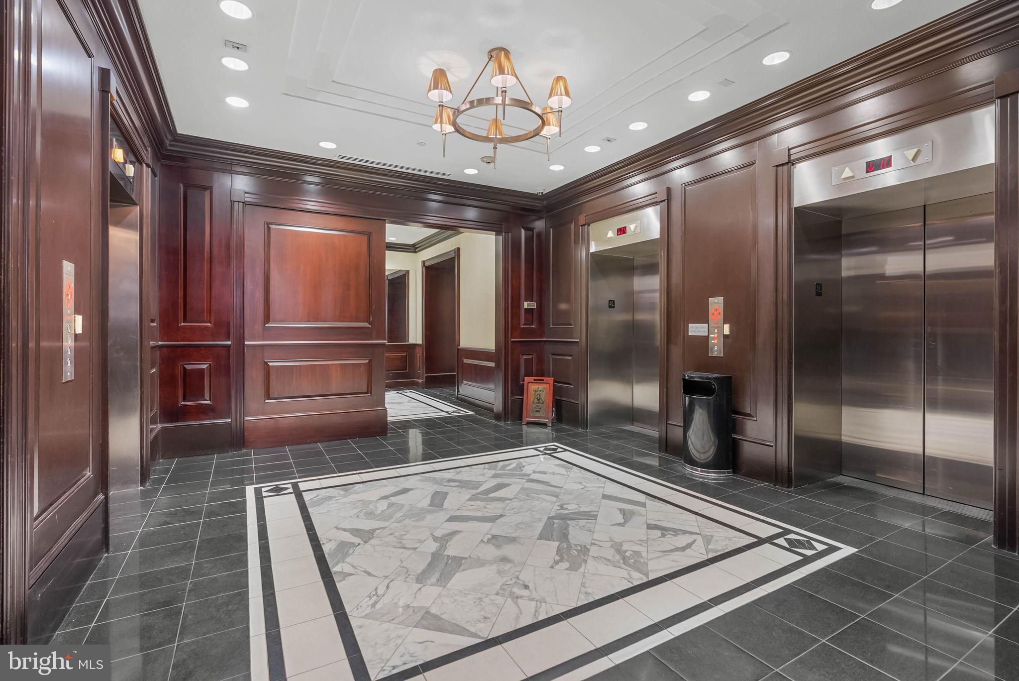 219 South 18th Street, Unit 404 Philadelphia, PA 19103 - Photo 17 of 24 a view of lobby with a couch and a chandelier