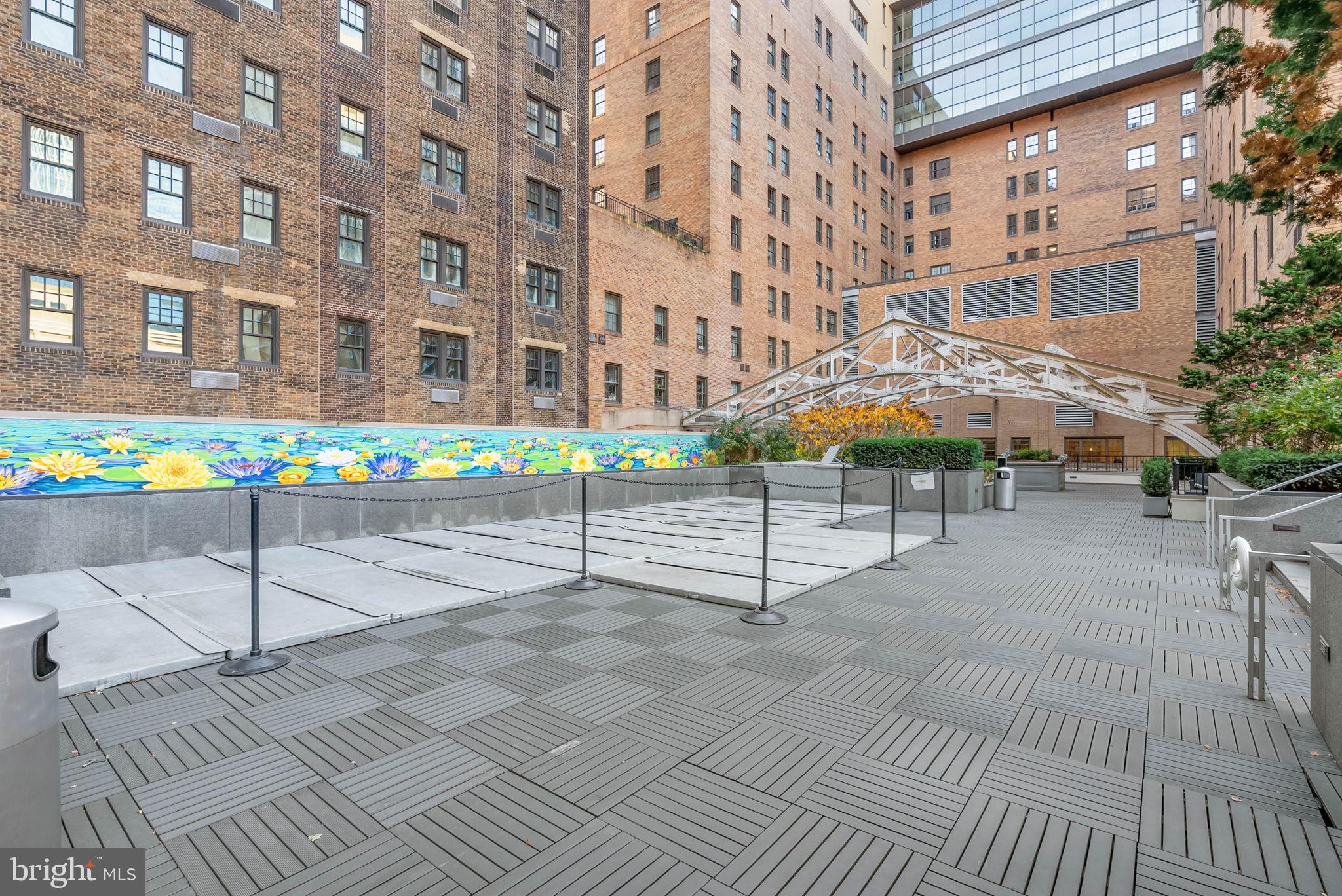 219 South 18th Street, Unit 404 Philadelphia, PA 19103 - Photo 20 of 24 a street sign on a sidewalk next to a building