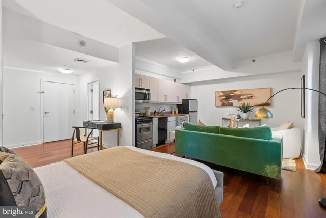 a bedroom with a bed and a table