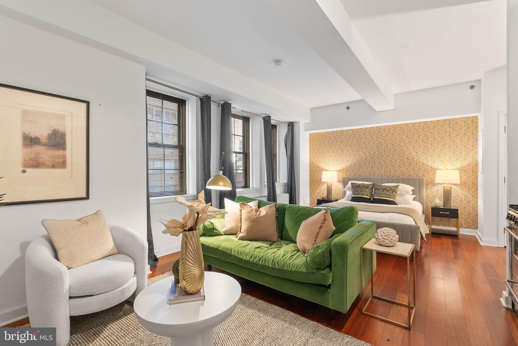 219 South 18th Street, Unit 404 Philadelphia, PA 19103 - Photo 10 of 24 a living room with furniture and a large window