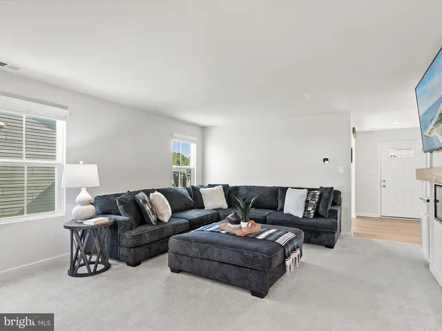 a living room with furniture and a couch