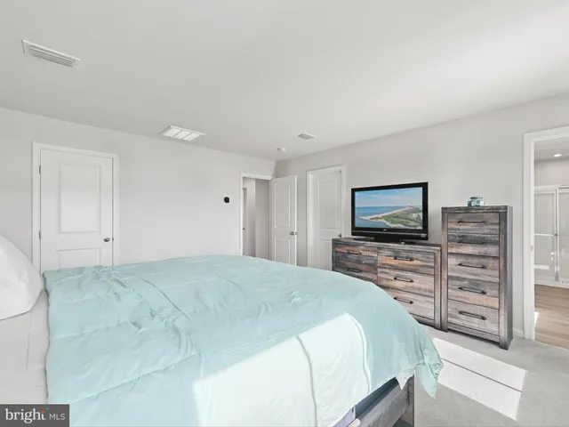 a bedroom with a bed and a cabinets