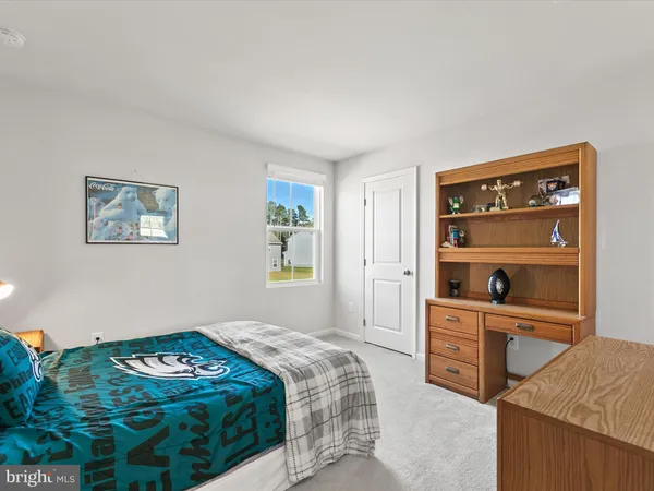 a bedroom with a bed and a closet