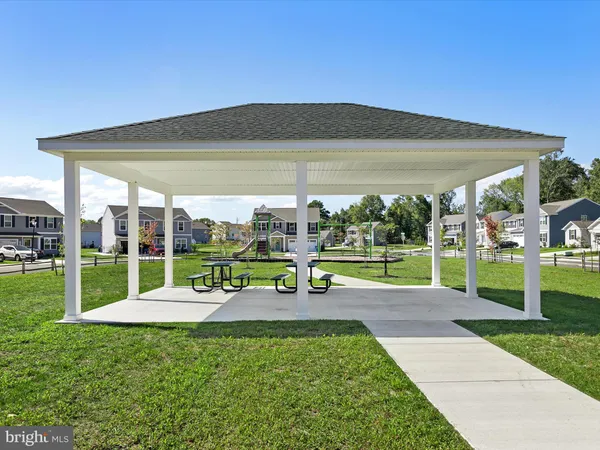 a childrens park with lots of swings and slides